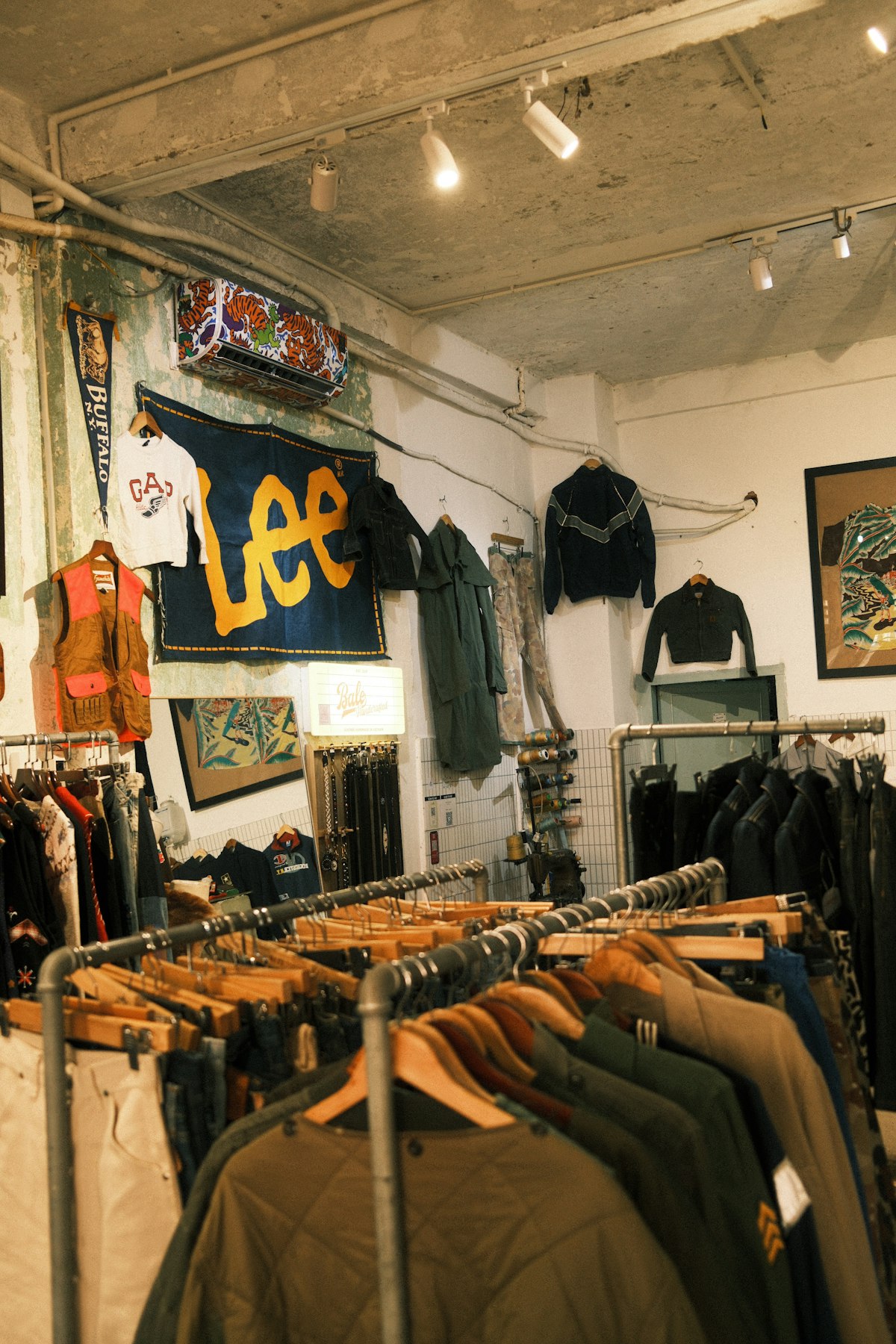 Inside the Chunxx Treasures shop: racks of vintage jackets under a Lee banner